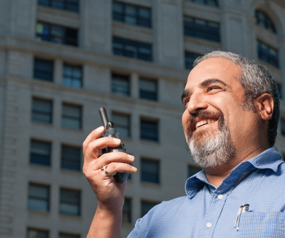 Person using Walkie Talkie for company