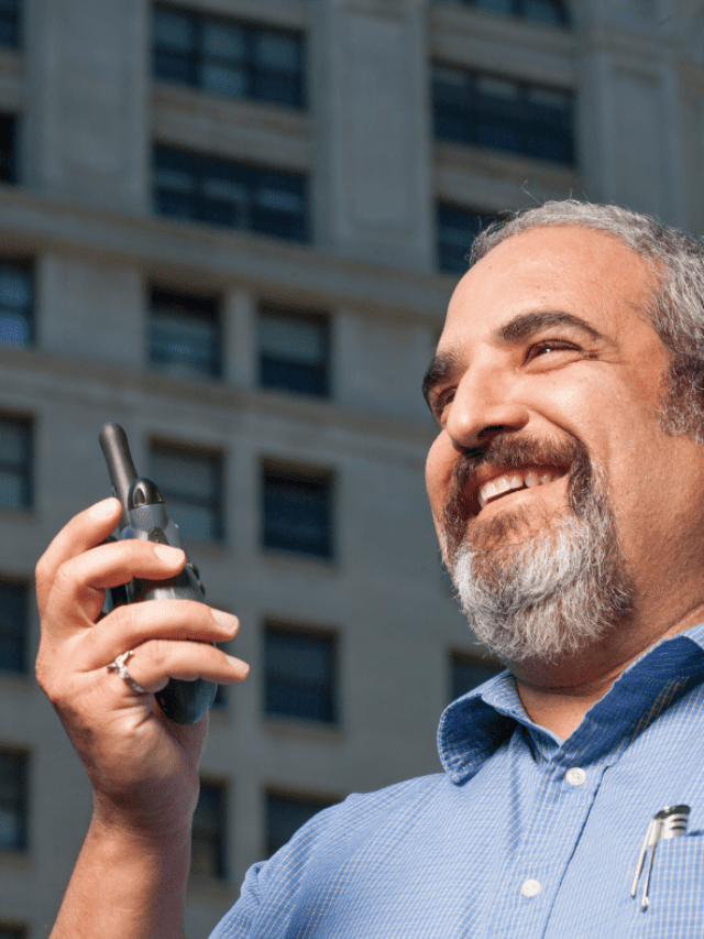 Person using Walkie Talkie for company