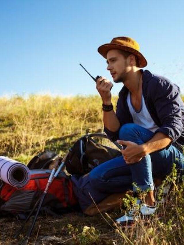 young-handsome-man-talking-walkie-talkie-radio-enjoying-canyon-view_176420-4272